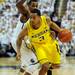 Michigan sophomore Trey Burke moves the ball past  Michigan State junior Keith Appling during the second half at Breslin Center in East Lansing on Tuesday, Feb. 12. Melanie Maxwell I AnnArbor.com